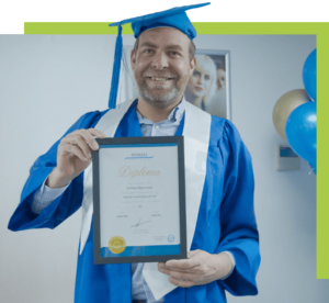 Andrew MacDonald beaming with pride at his Pitman Training Newcastle graduation ceremony, wearing traditional cap and gown